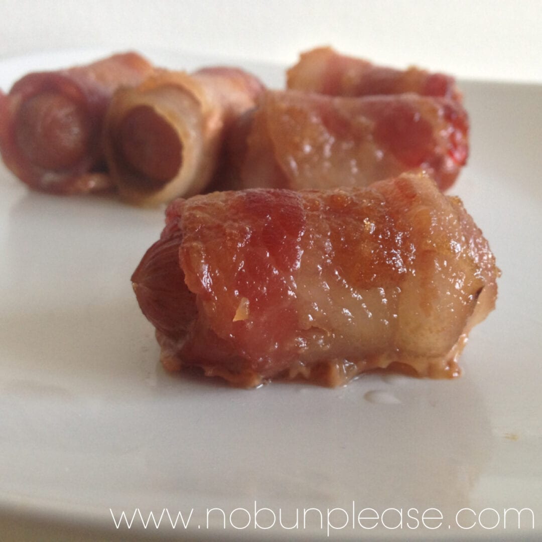 candied-bacon-wrapped-sausages Sweet and savory sausages wrapped in bacon and candied with just a pinch of brown sugar.