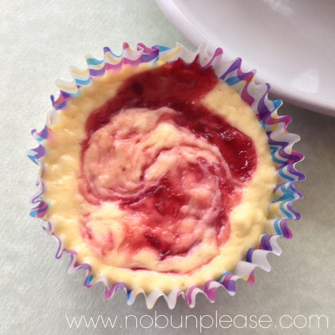 Delicious low carb cheese cake swirled with sweet raspberry swirls.