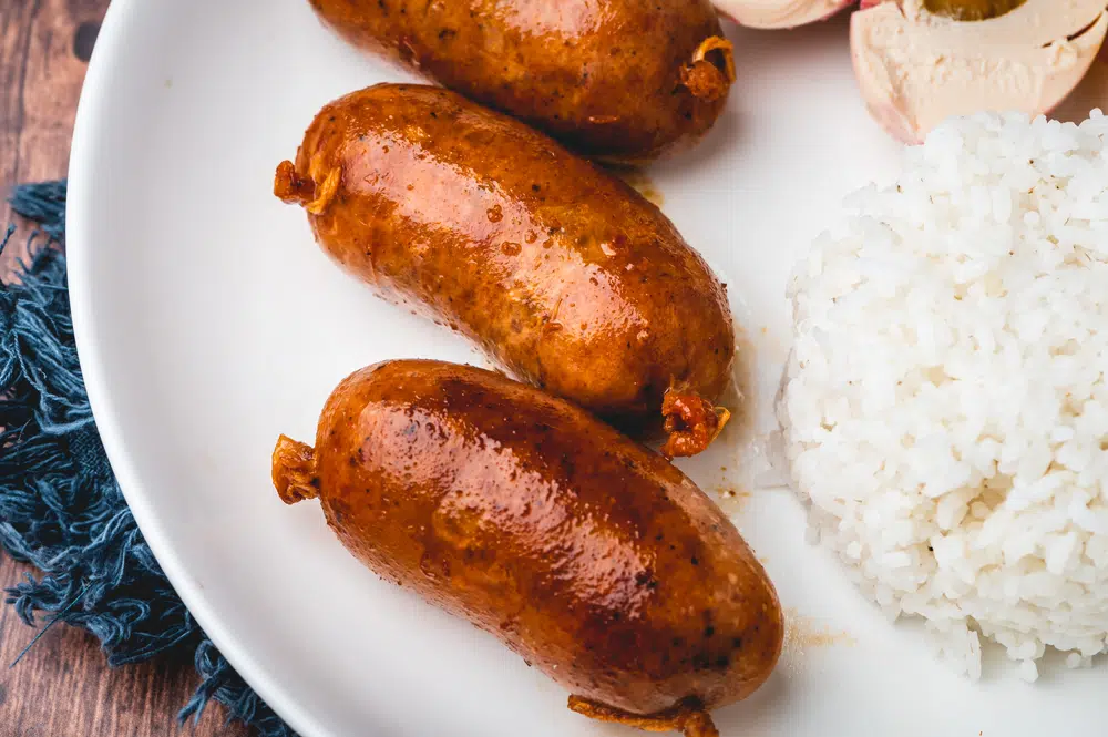 Close Up Of Longganisa With Steamed Rice And Salted Egg