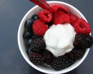 Red Mango Frozen Yogurt Top View With Fruit Toppings