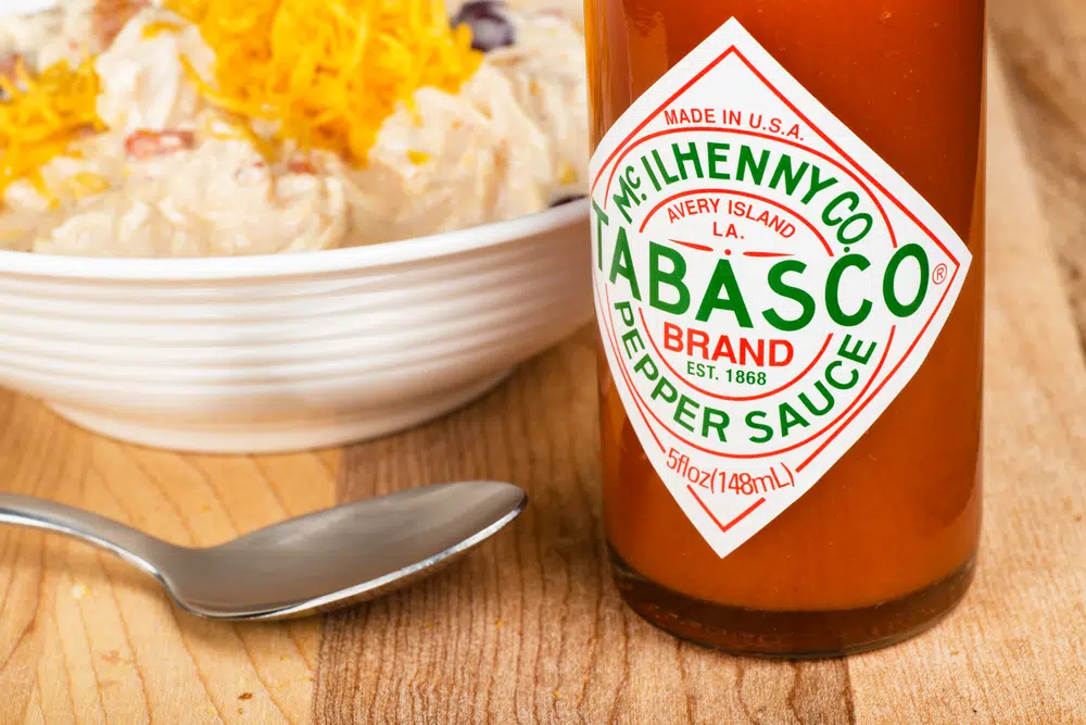 Bottle Of Tabasco Hot Pepper Sauce Next To A Bowl Of White Chicken Chili