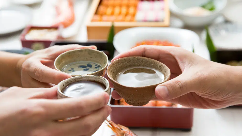 Three Hands Toast With Sake