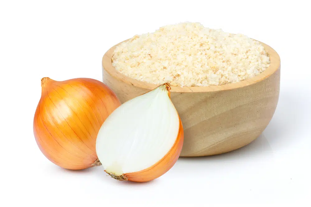 Onion Powder In Wooden Bowl And Fresh Onion
