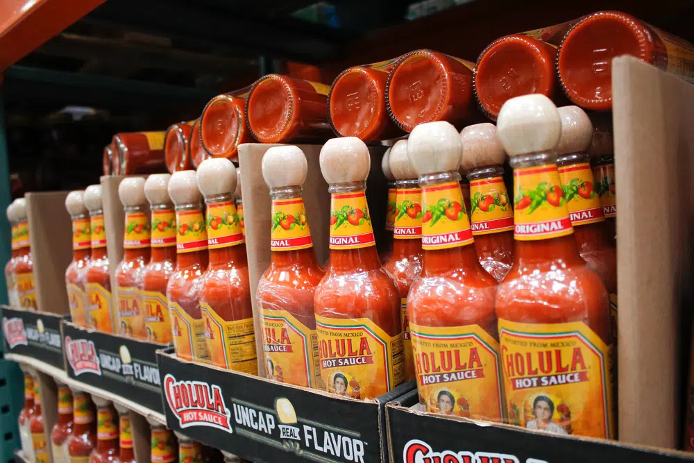 Several Bottles Of Cholula Hot Sauce On Display At A Local Grocery Store
