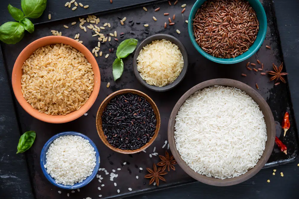 Different Types Of Rice In Bowls - Red, Black, Basmati, Whole Grain, Long Grain Parboiled And Arborio
