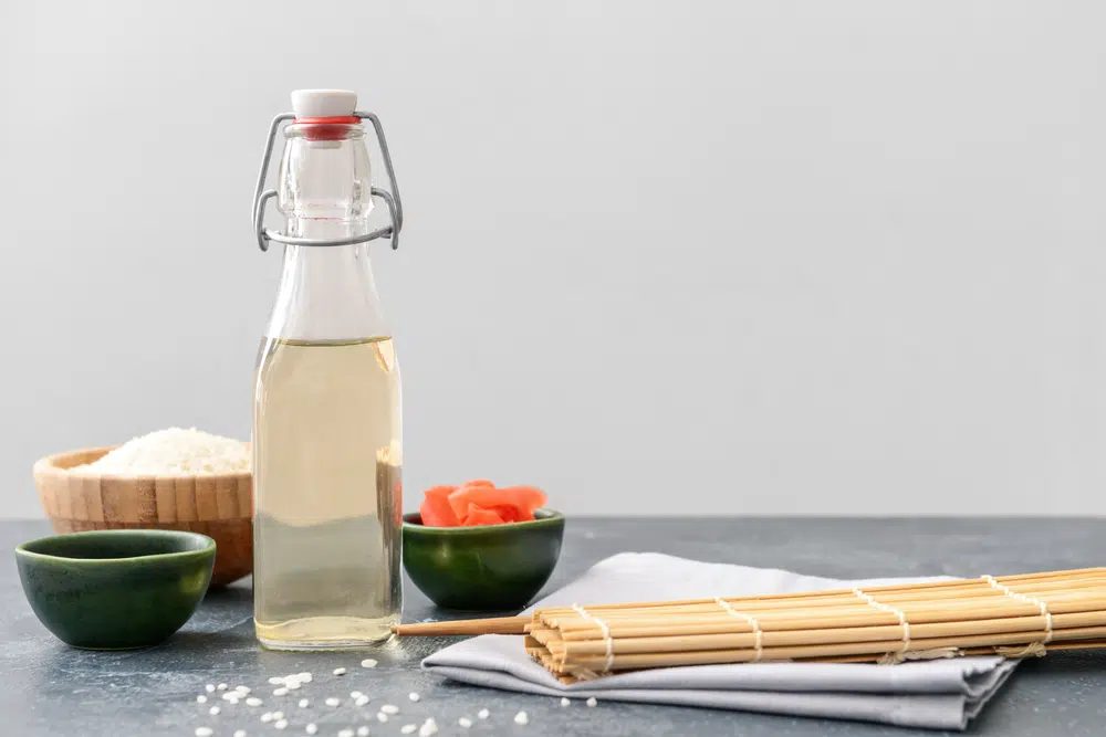 Rice Vinegar With Sushi Ingredients On The Table