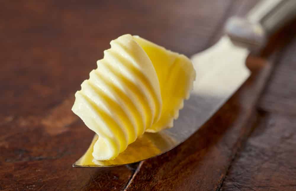 Close Up Of Swirl Of Fresh Farm Butter Displayed On A Silver Vintage Butter Knife