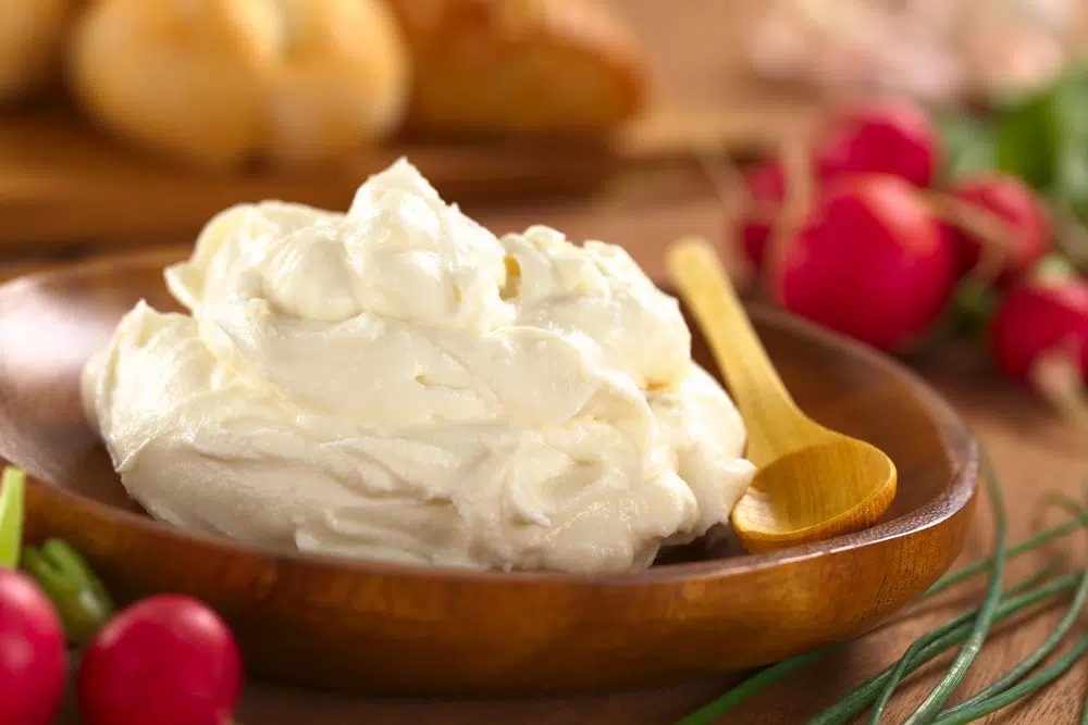 Fresh Cream Cheese Spread On Wooden Plate