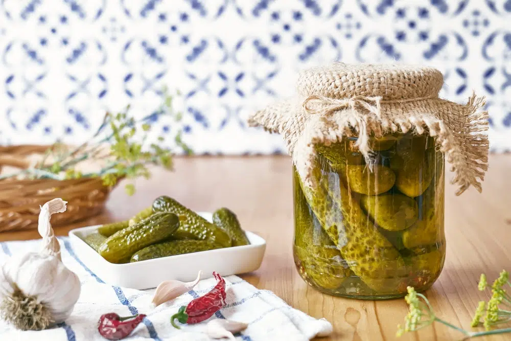 Salted Pickled Cucumbers Preserved Canned In Glass Jar.