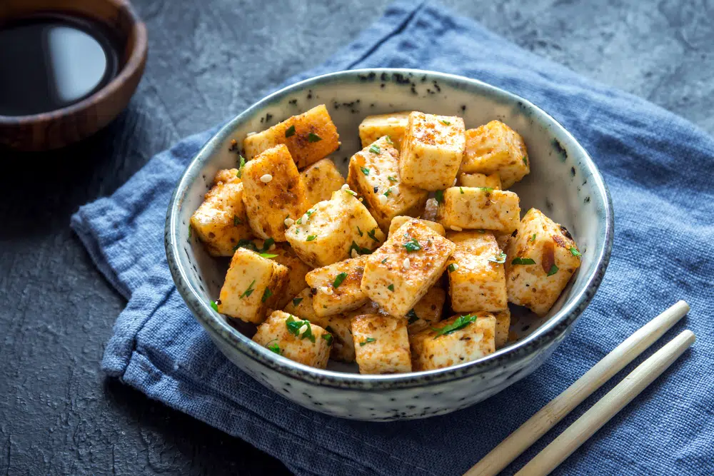 Stir Fried Tofu In A Bowl With Sesame And Greens