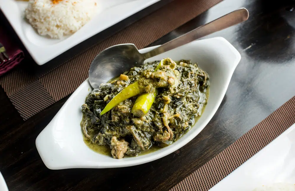A Philippine Dish Of Shredded Or Whole Taro Leaves With Meat Cooked In Thick Coconut Milk 