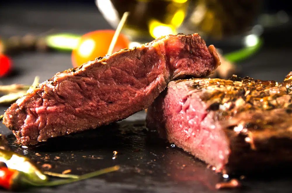 Rare Steak On A Black Rectangular Plate