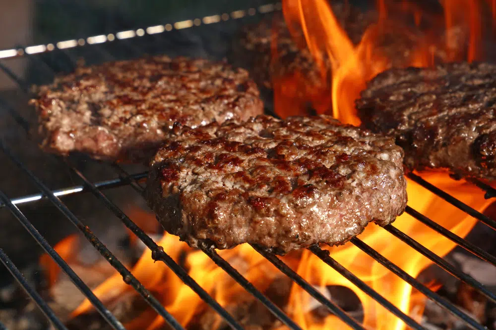Close Up Of Hamburger Meat Grilled On Bbq Fire Flame Grill
