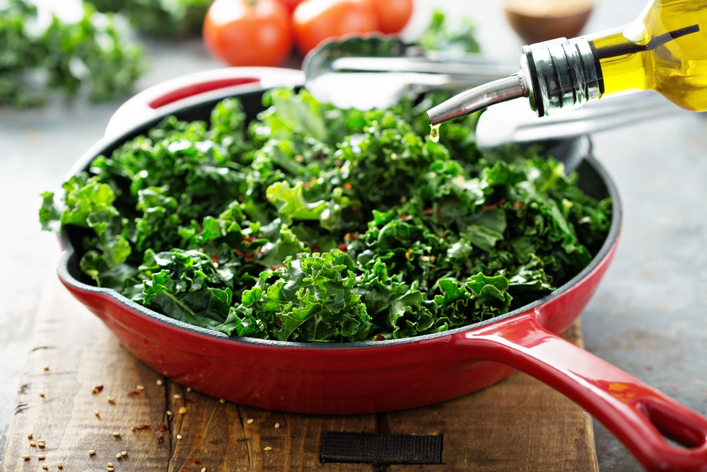 Quickly Sauteed Kale With Chili Flakes In A Cast Iron Pan