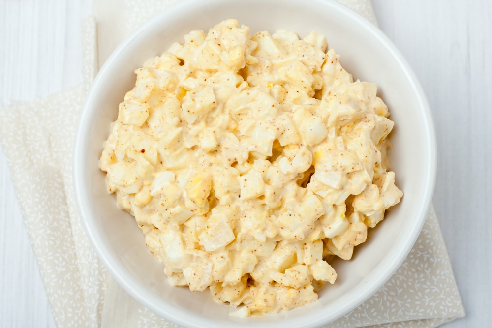 Homemade Egg Salad In White Bowl On White Background